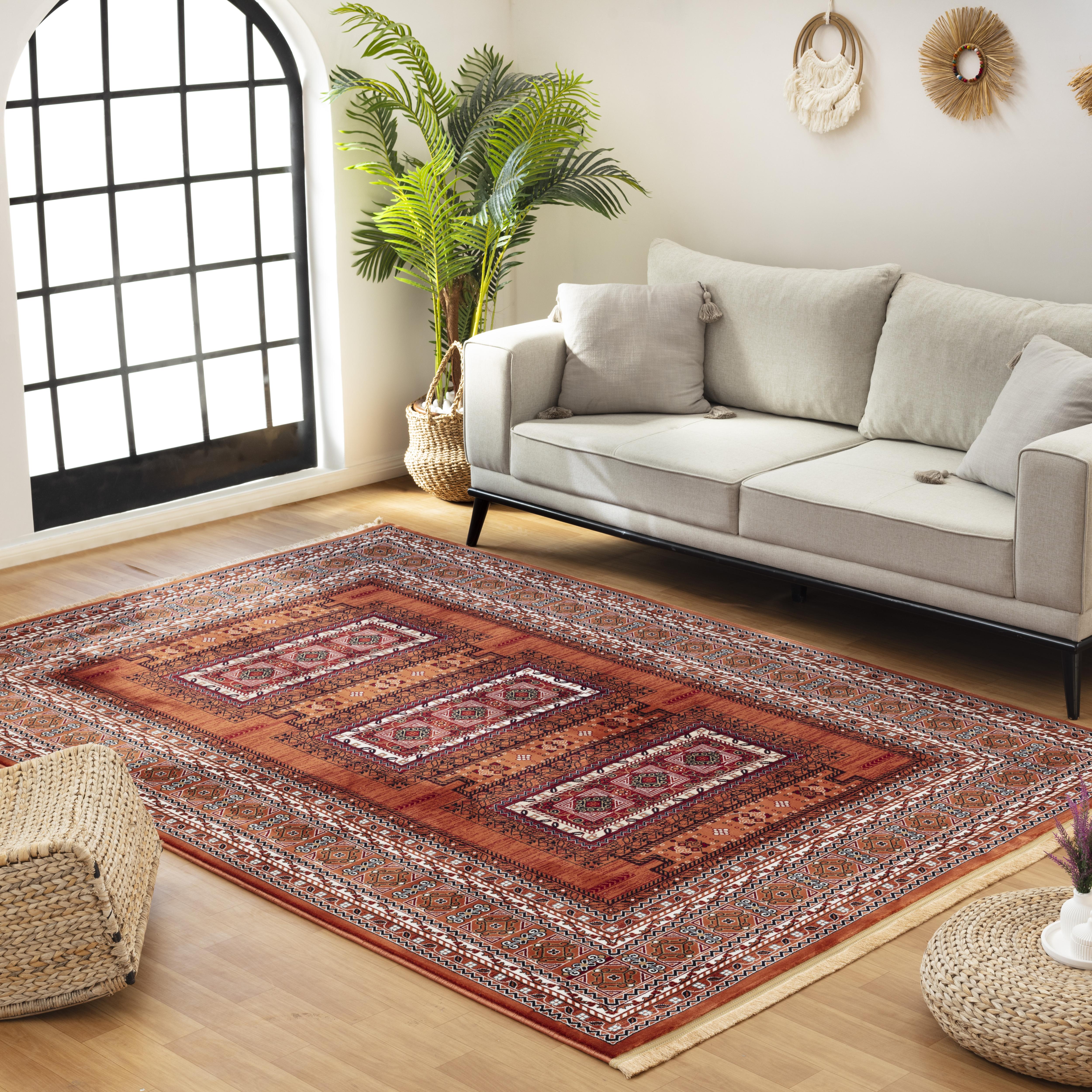 Kandahar E851B Rose area rug in a styled living room setting