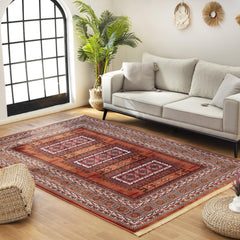 Kandahar E851B Rose area rug in a styled living room setting